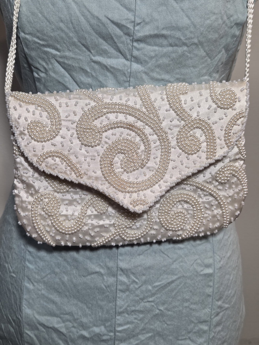 La Regale LTD handmade cream silk beaded clutch